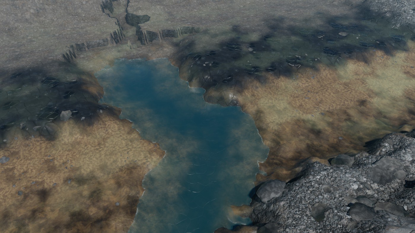 Wide terrain view: a blue river cutting a broad tan and grey basin under haze.